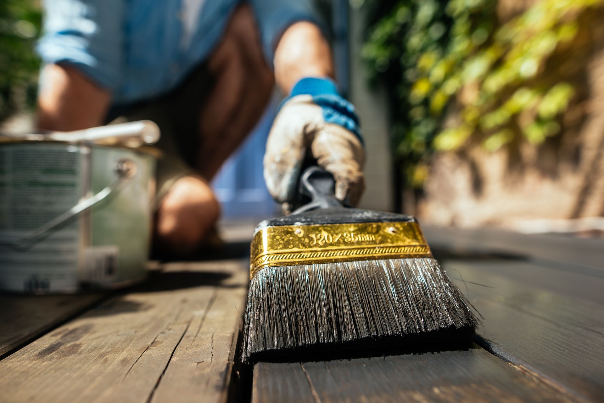 Painting wooden deck with brush